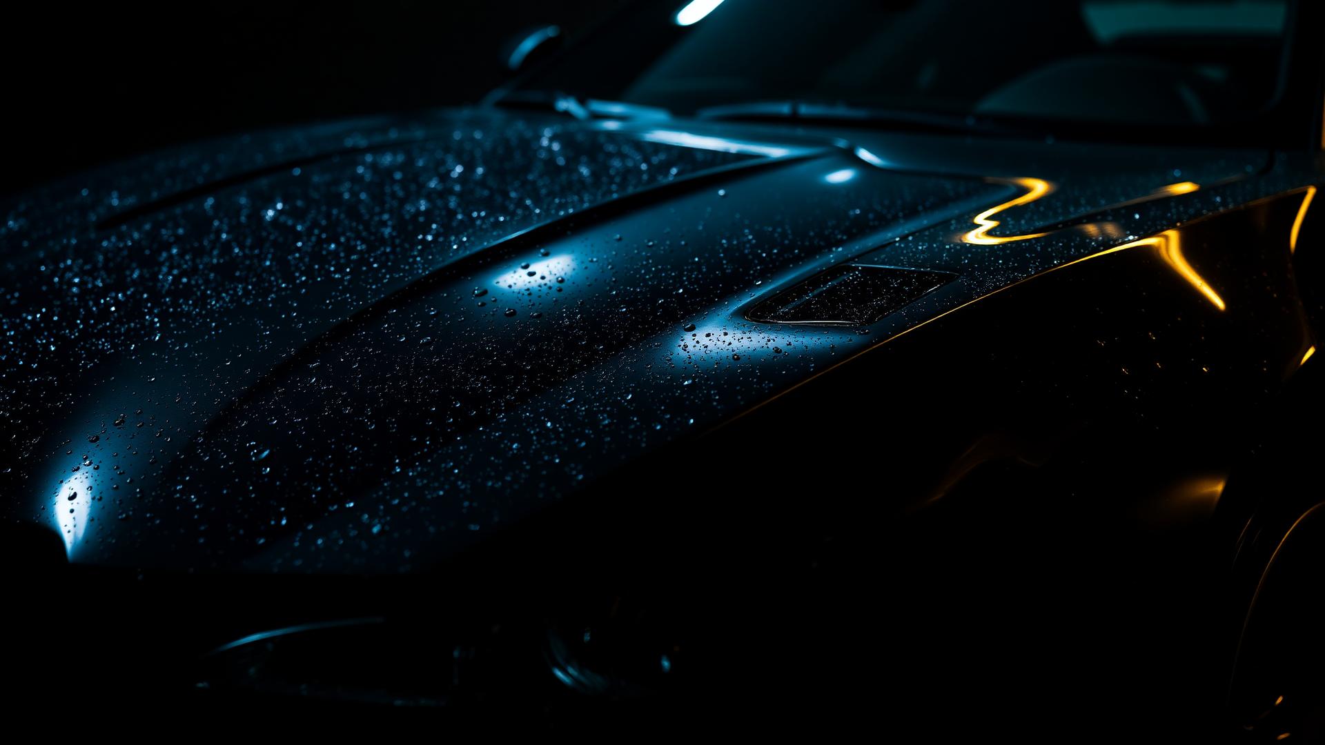 Freshly detailed luxury car reflecting warm light
